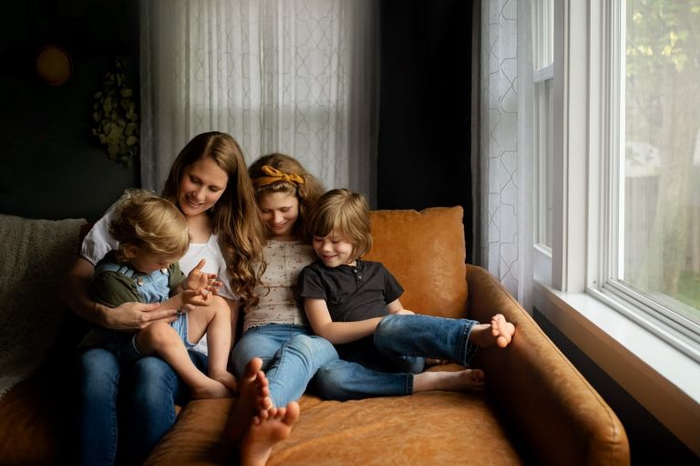 Findlay Family Photographer mother with 3 kids on couch photo by cynthia dawson photography