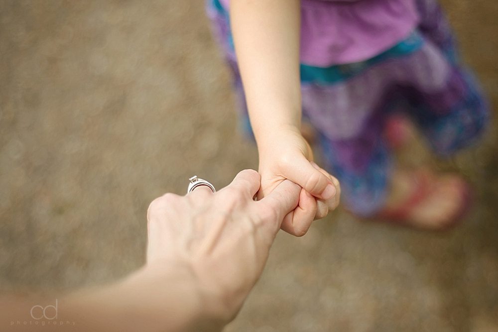 mother and daughter holding hands