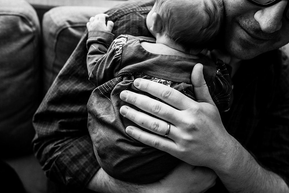 toledo newborn photographer dad holding baby photo by Cynthia Dawson Photography