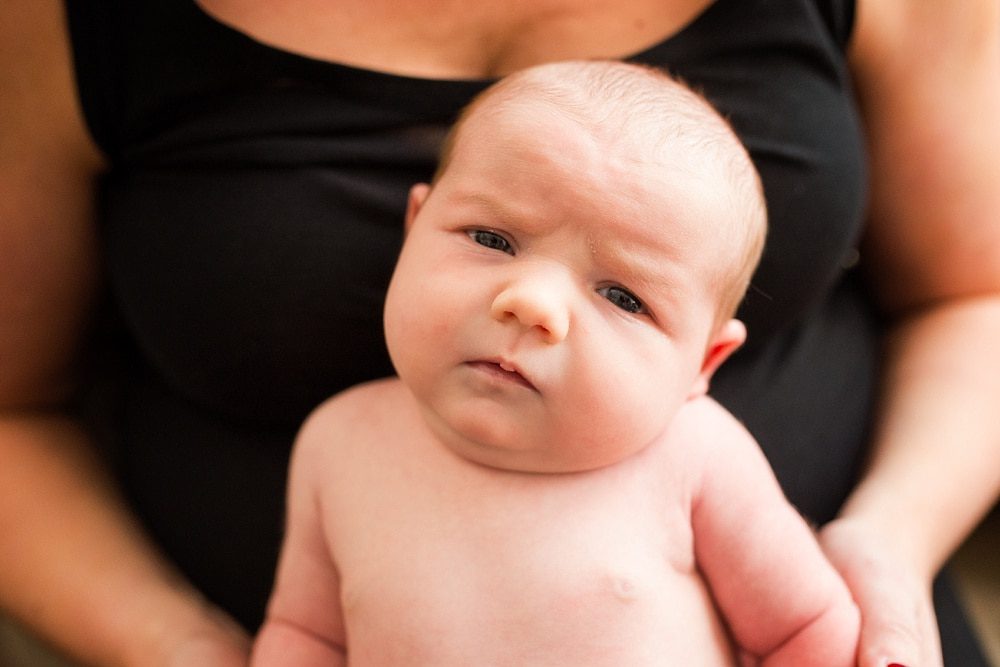 toledo newborn photogrpaher baby looking at camera photo by Cynthia Dawson Photography