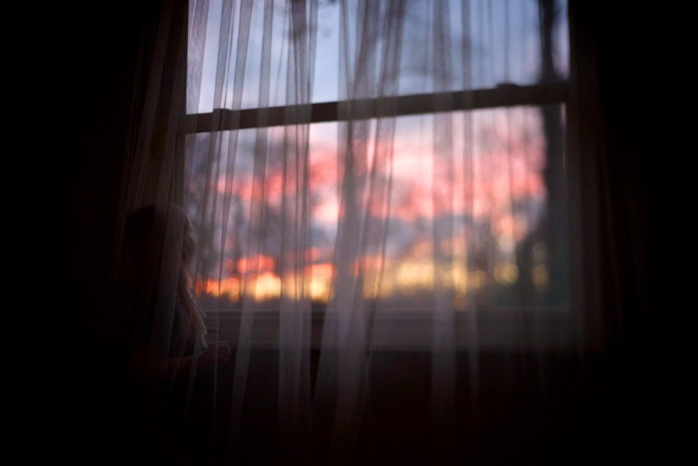 Freelensing Tutorial girl looking out window photo by cynthia dawson photography 