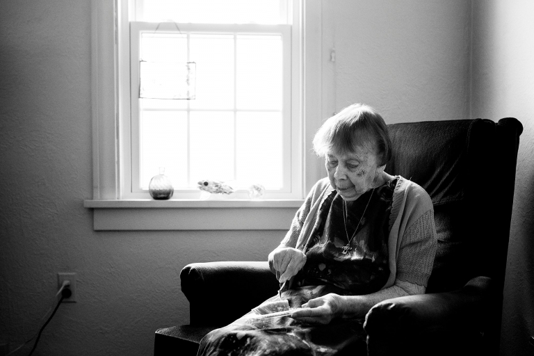 Toledo Ohio Event Photographer older woman eating cake photo by Cynthia Dawson Photography 