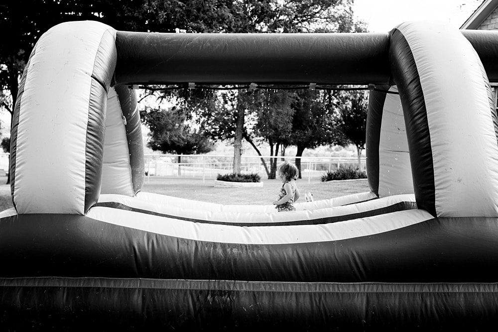 Event Photographer Toledo Ohio girl in bounce house at birthday party photo by Cynthia Dawson Photography 