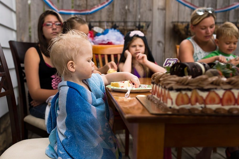 Event Photographer Toledo Ohio boy eating cake photo by Cynthia Dawson Photography 