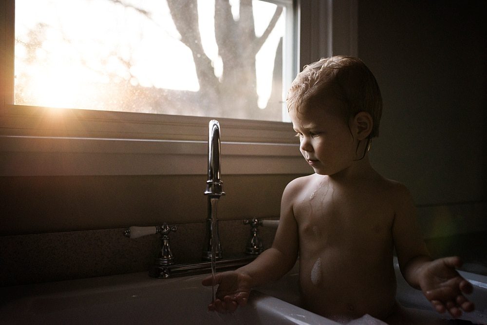 Lifestyle Photographer Toledo boy in sink bath photo by Cynthia Dawson Photography