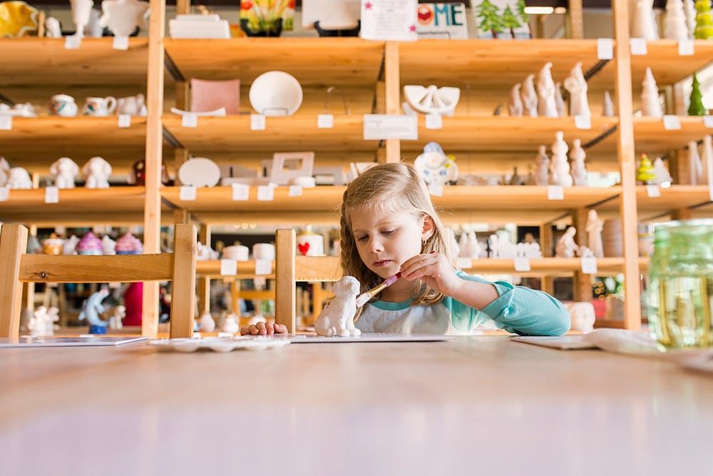 Birthday Party Places Toledo Ohio girl painting pottery photo by Cynthia Dawson Photography