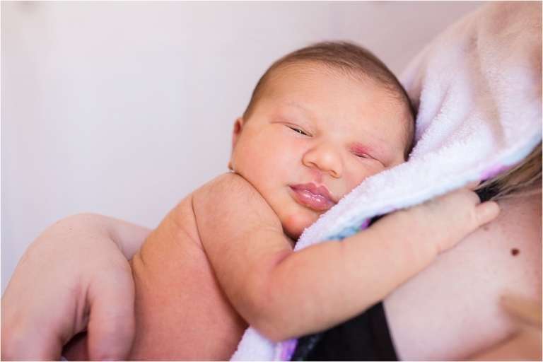 Toledo OH Newborn Photographer newborn cuddling with mother photo by Cynthia Dawson Photography