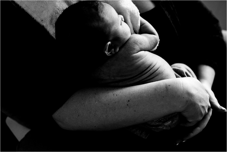 Toledo OH Newborn Photographer newborn girl cuddling with mother photo by Cynthia Dawson Photography
