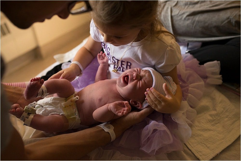 Labor and Delivery Toledo Hospital new sister holding baby photo by Cynthia Dawson Photography 