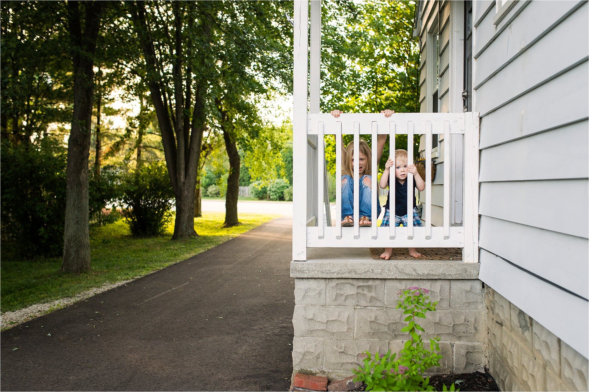 Toledo Lifestyle Photos two kids on the front porch photo by Cynthia Dawson Photography 