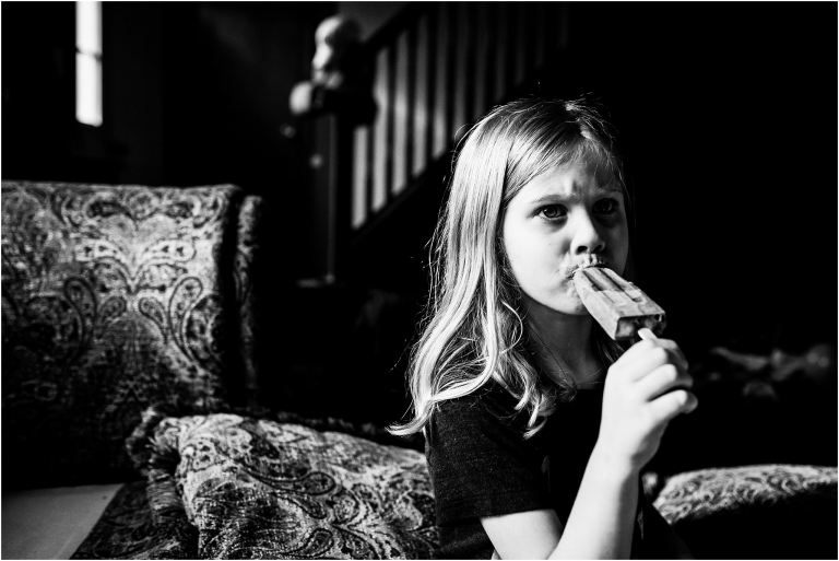 Documentary Photographer Toledo Ohio girl eating popsicle photo by Cynthia Dawson Photography 