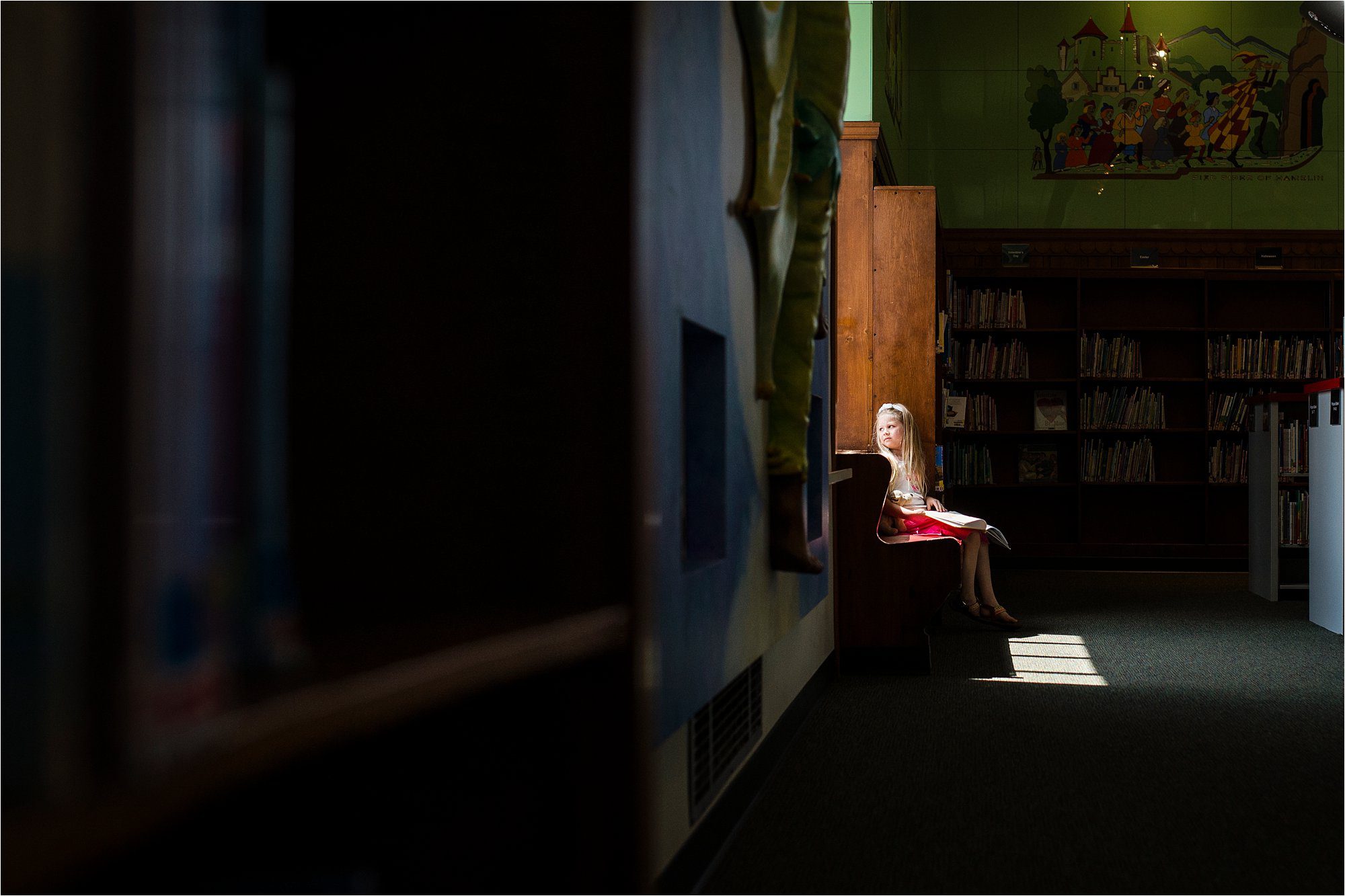 7 Ways to Use the Environment Around You to Frame Your Subject girl sitting by window photo by Cynthia Dawson Photography 