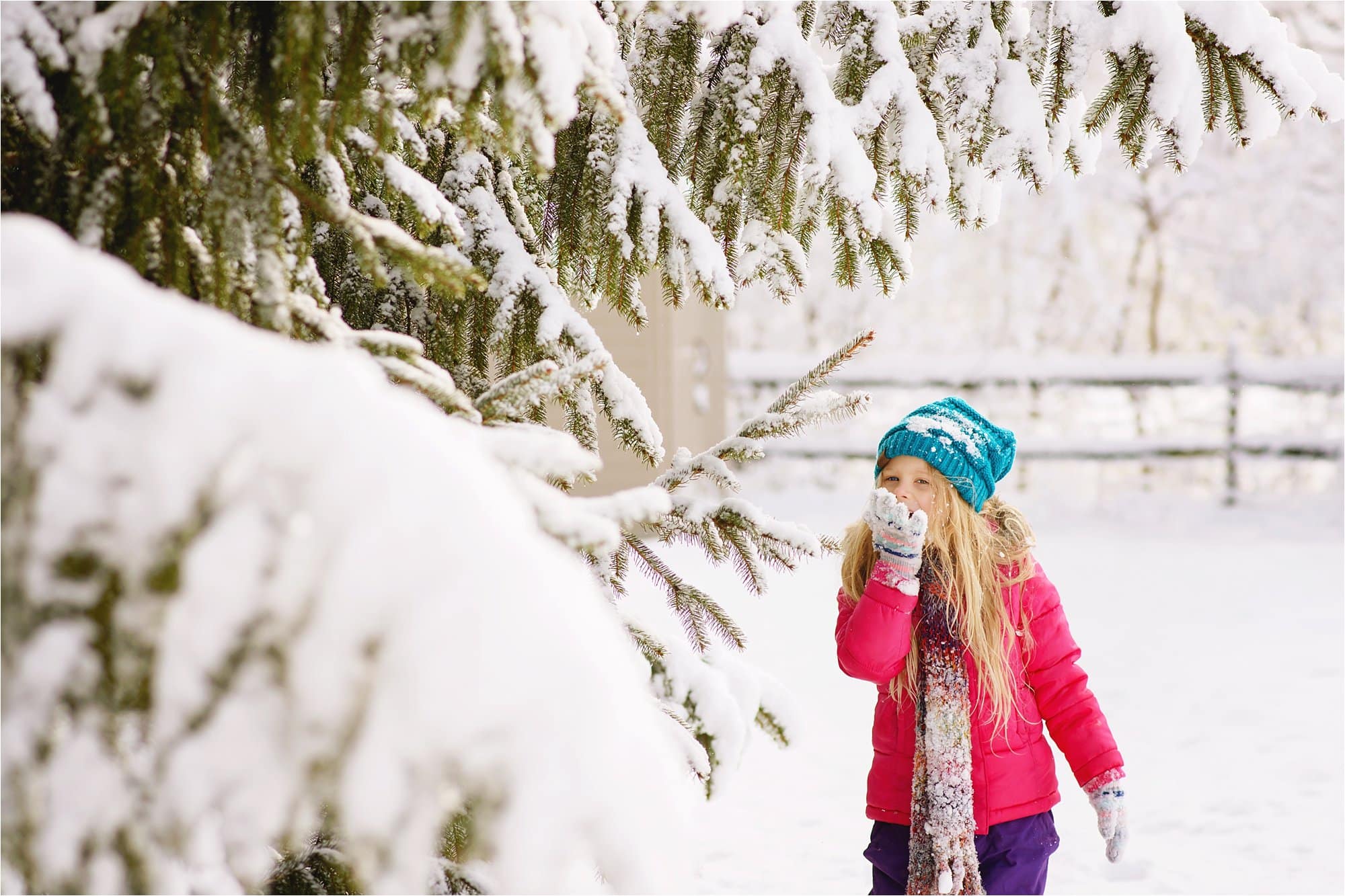 7 Ways to Use the Environment Around You to Frame Your Subject girl eating snow photo by Cynthia Dawson Photography 