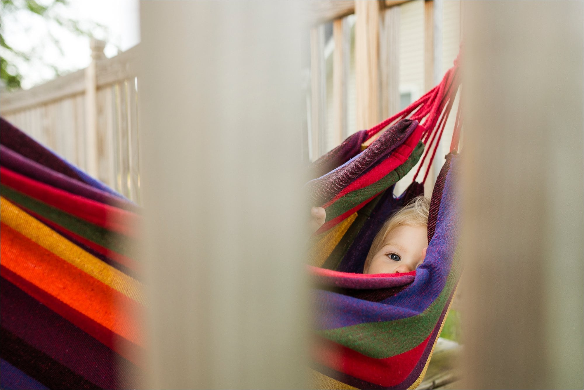 7 Ways to Use the Environment Around You to Frame Your Subject toddler in hammock photo by Cynthia Dawson Photography 