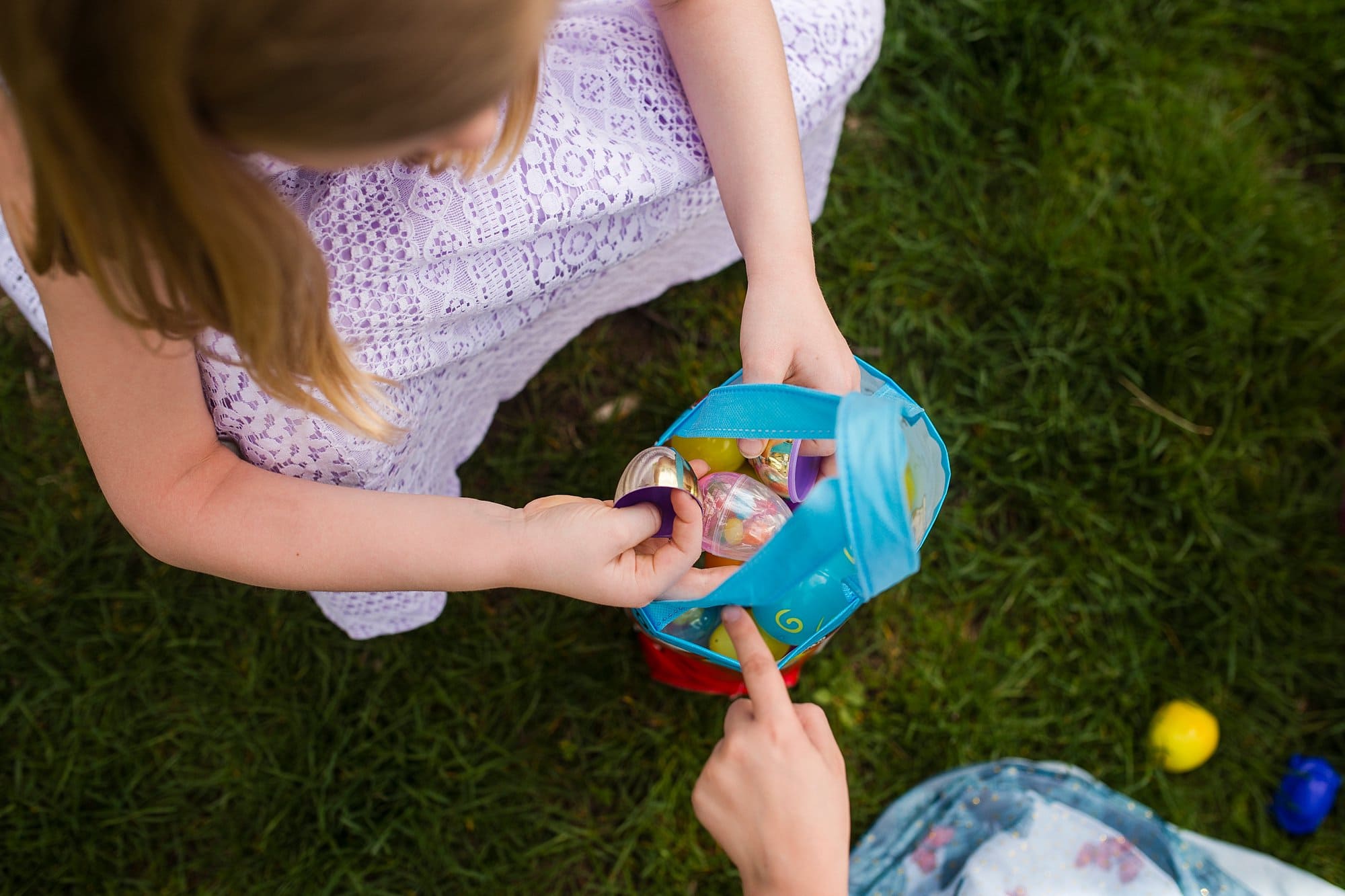 Child Photographer Perrysburg girls with easter eggs photo by Cynthia Dawson Photography