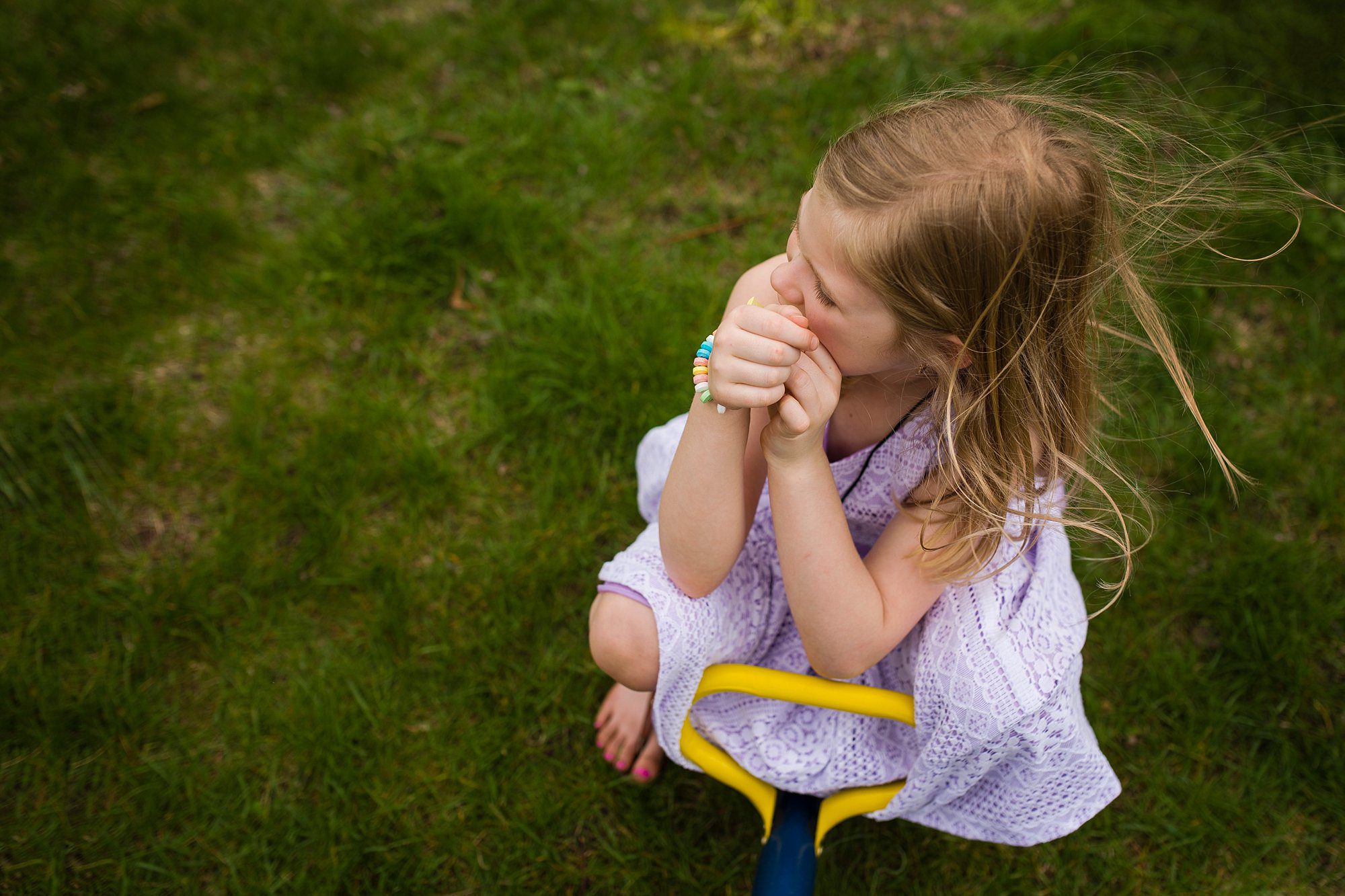 Child Photographer Perrysburg girl eating candy photo by Cynthia Dawson Photography