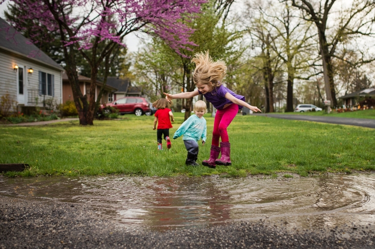 Toledo Area Photographers kids playing in mud puddle photo by Cynthia Dawson Photography