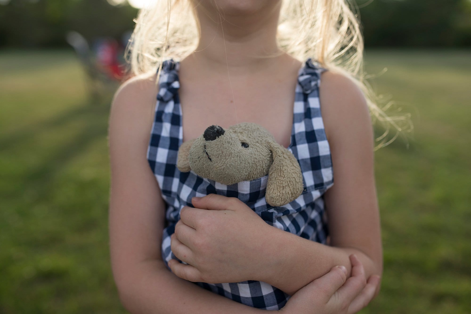 Harbortown RV Resort girl hugging stuffed animal photo by Cynthia Dawson photography