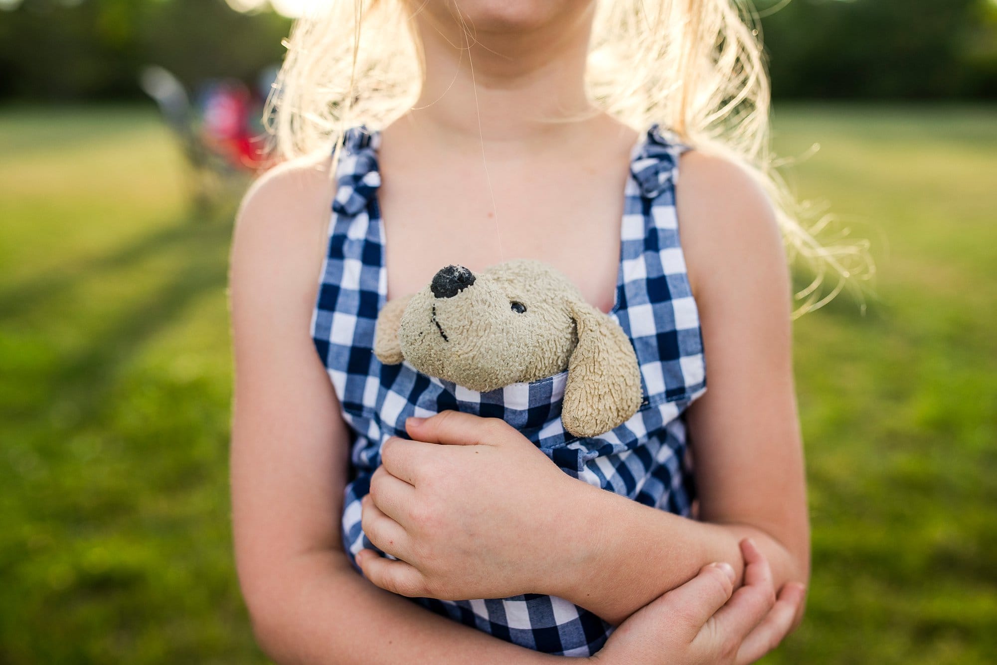 Harbortown RV Resort girl hugging stuffed animal photo by Cynthia Dawson photography