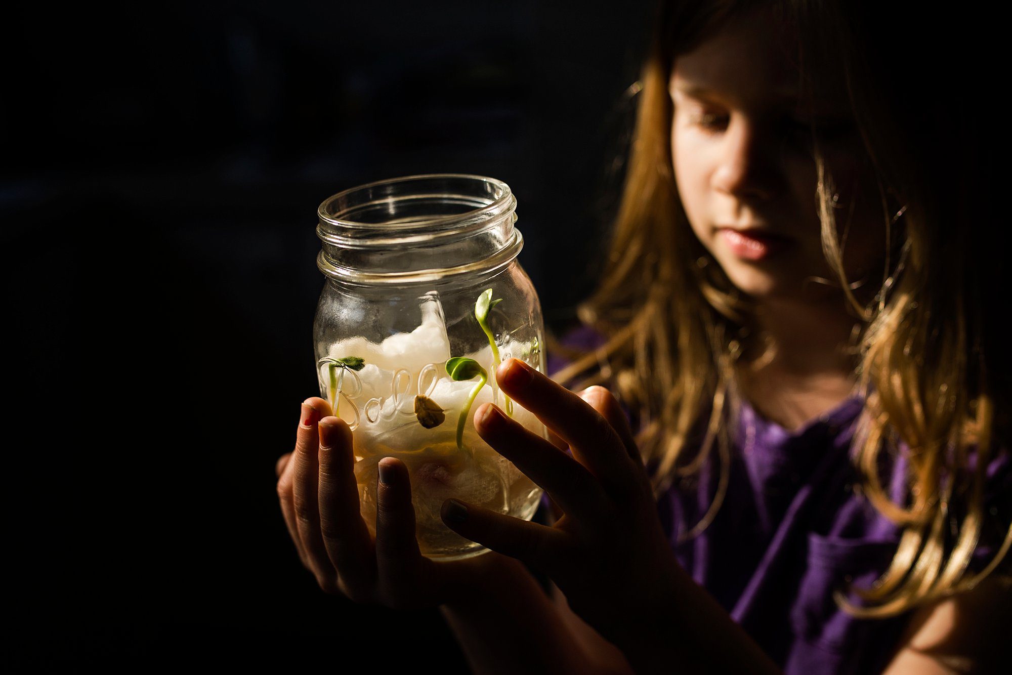 Documentary Photographer Toledo girl holding seedlings photo by Cynthia Dawson Photography