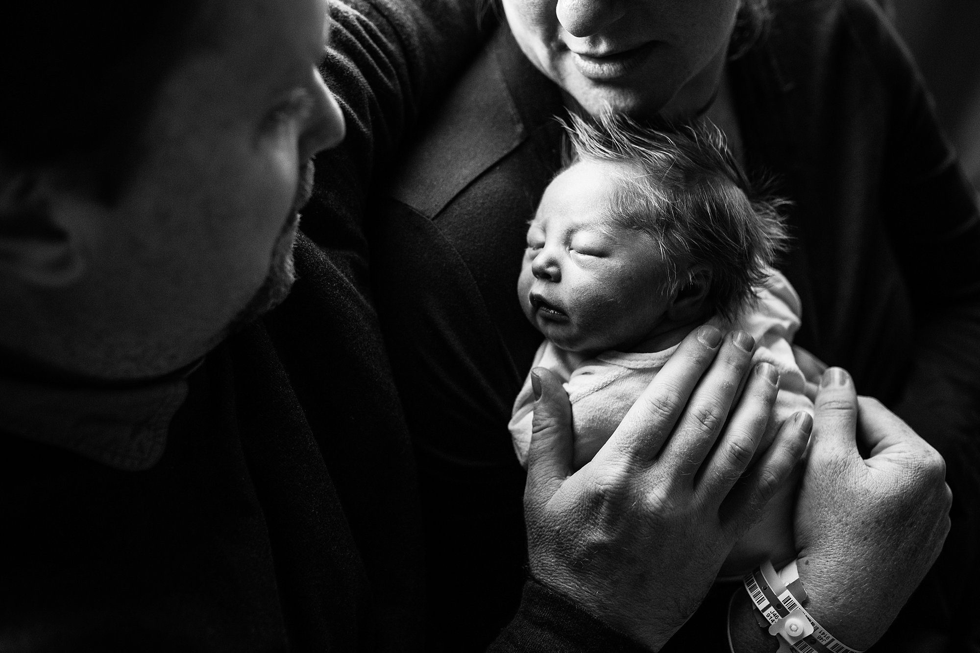 Labor and Delivery St. Charles Hospital parents holding newborn photo by Cynthia Dawson Photography