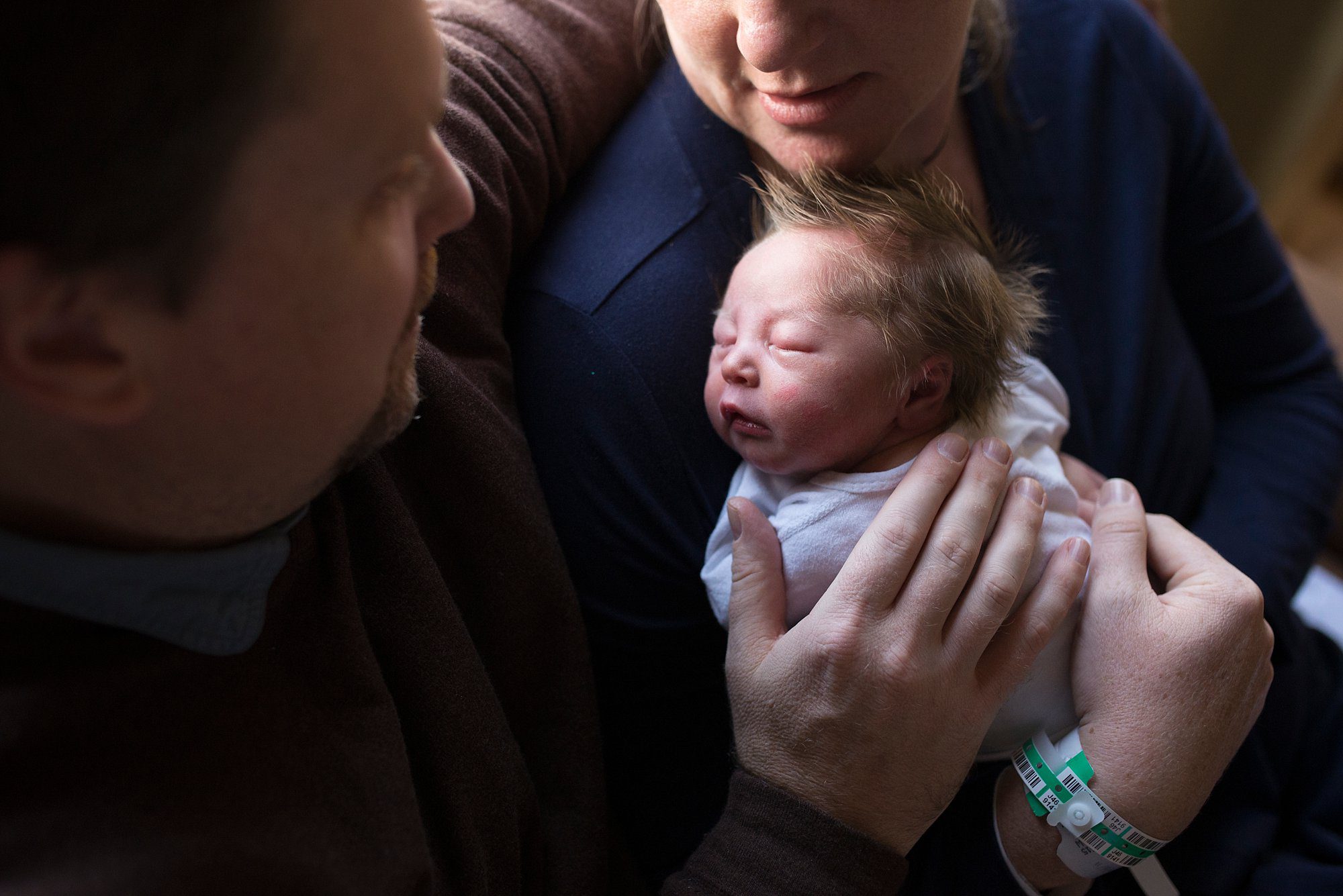 Labor and Delivery St. Charles Mercy Hospital parents holding newborn photo by Cynthia Dawson Photography