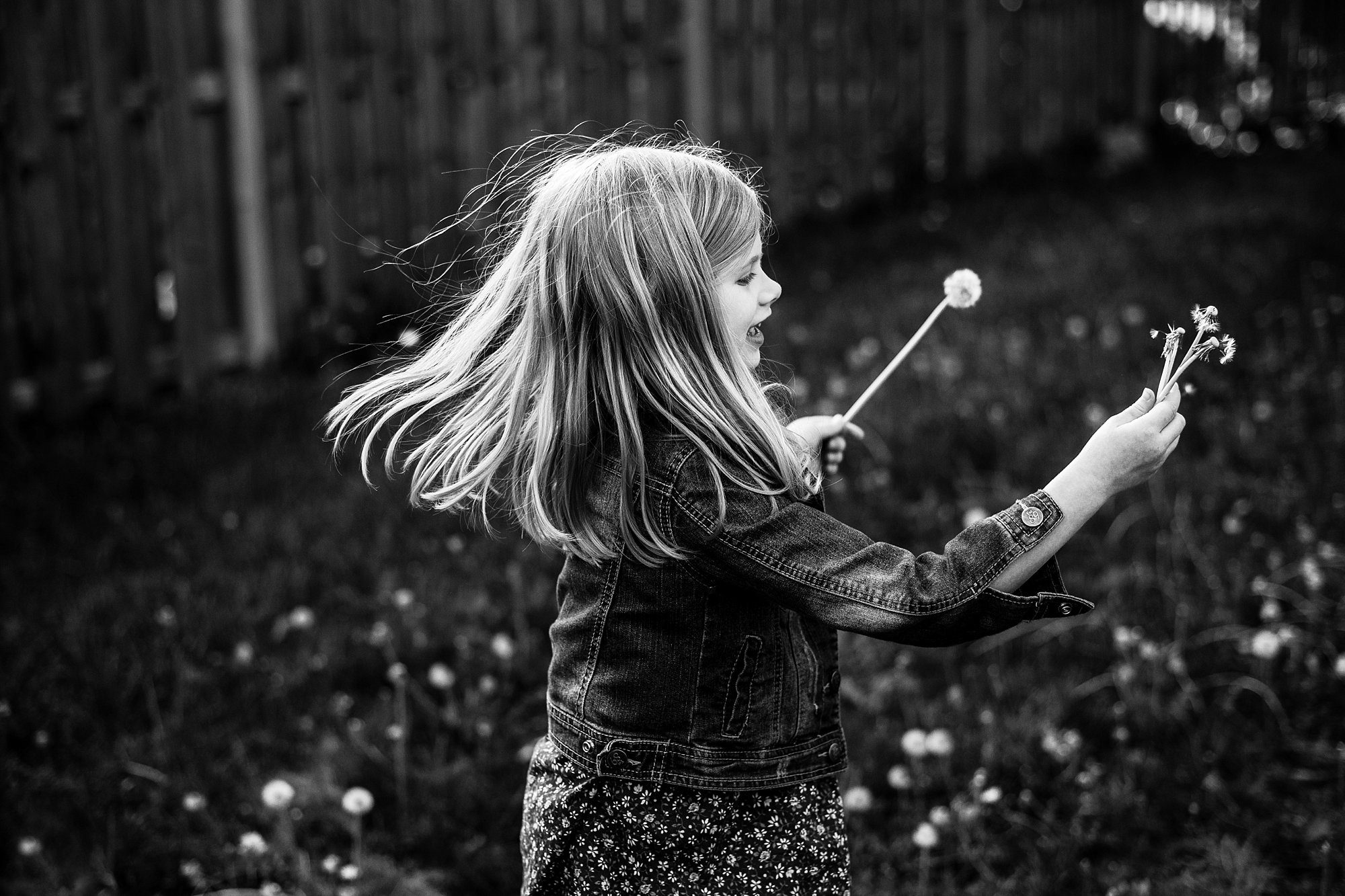 toledo lifestyle photo sessions girl spinning flower photo by Cynthia Dawson Photography