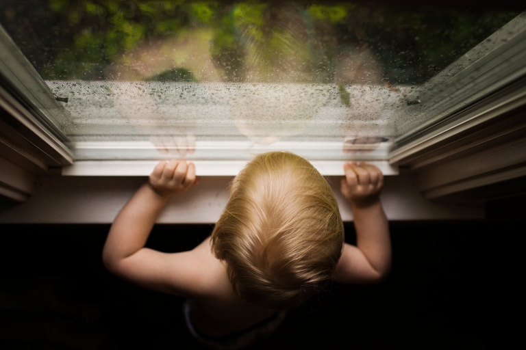 findlay ohio photography toddler looking out window photo by Cynthia Dawson Photography