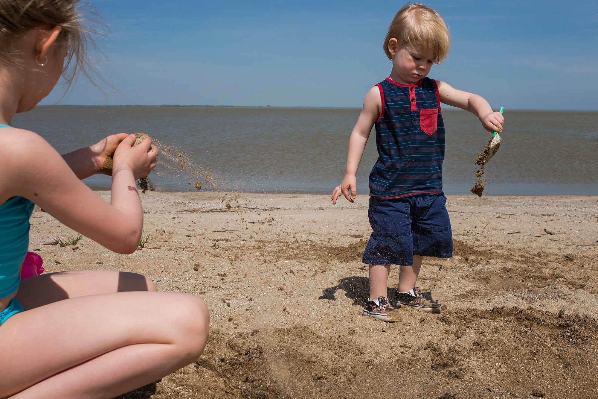 Family Photographer in Toledo Ohio kids playing in the sand photo by Cynthia Dawson Photography