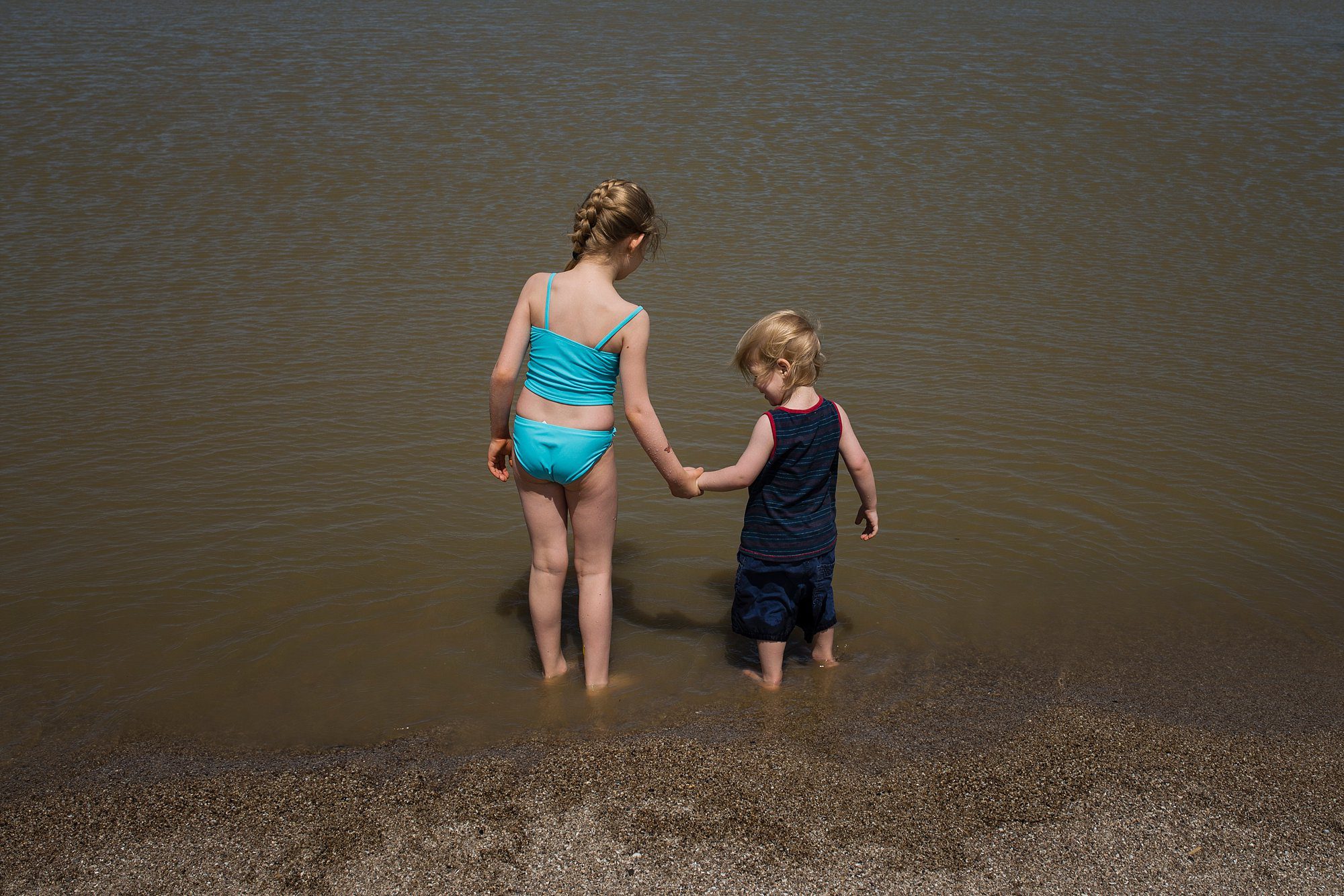 Family Photographer in Toledo Ohio two kids in lake photo by Cynthia Dawson Photography