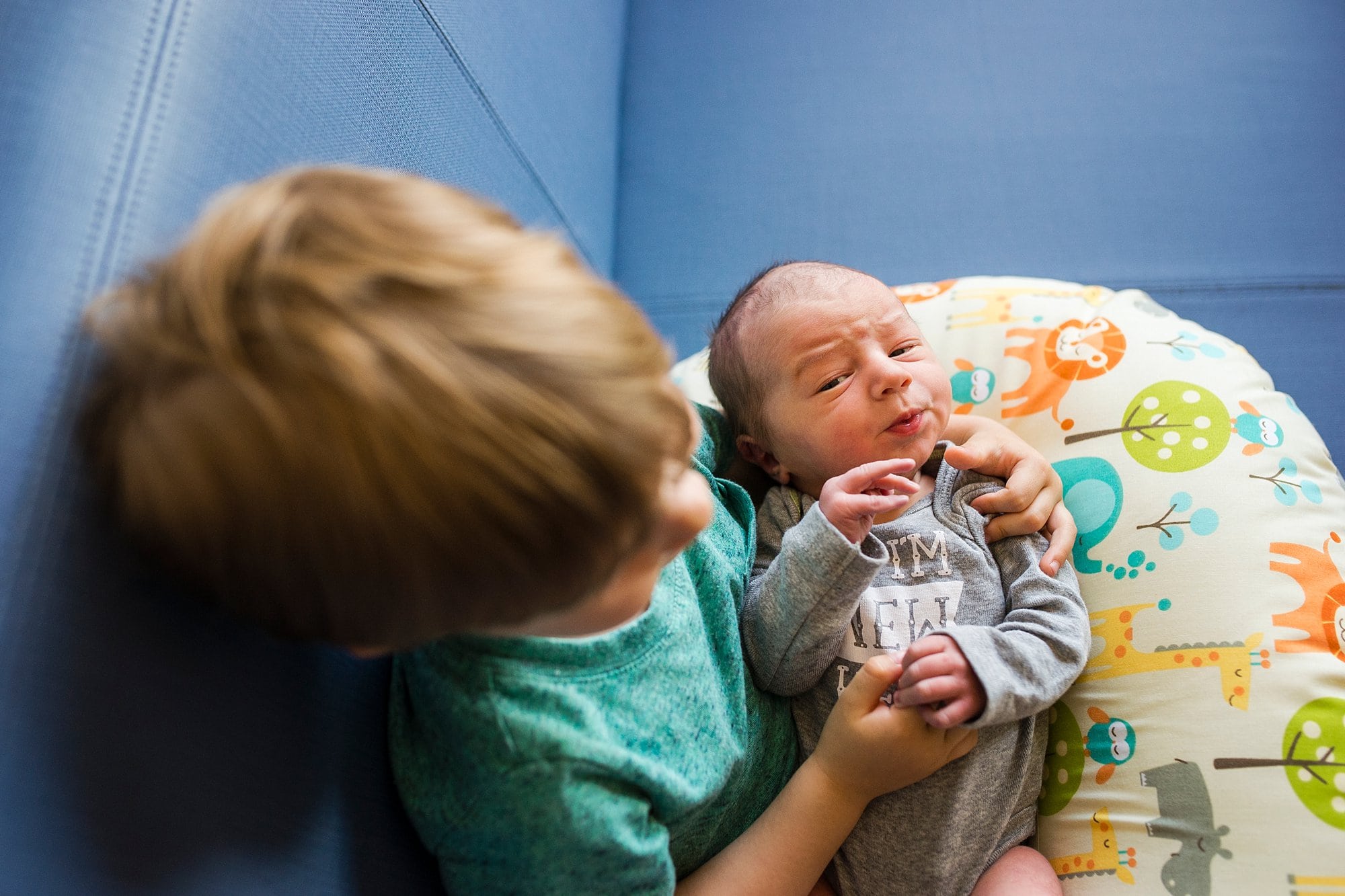 Toledo Hospital Baby Photos brother holding newborn photo by Cynthia Dawson Photography