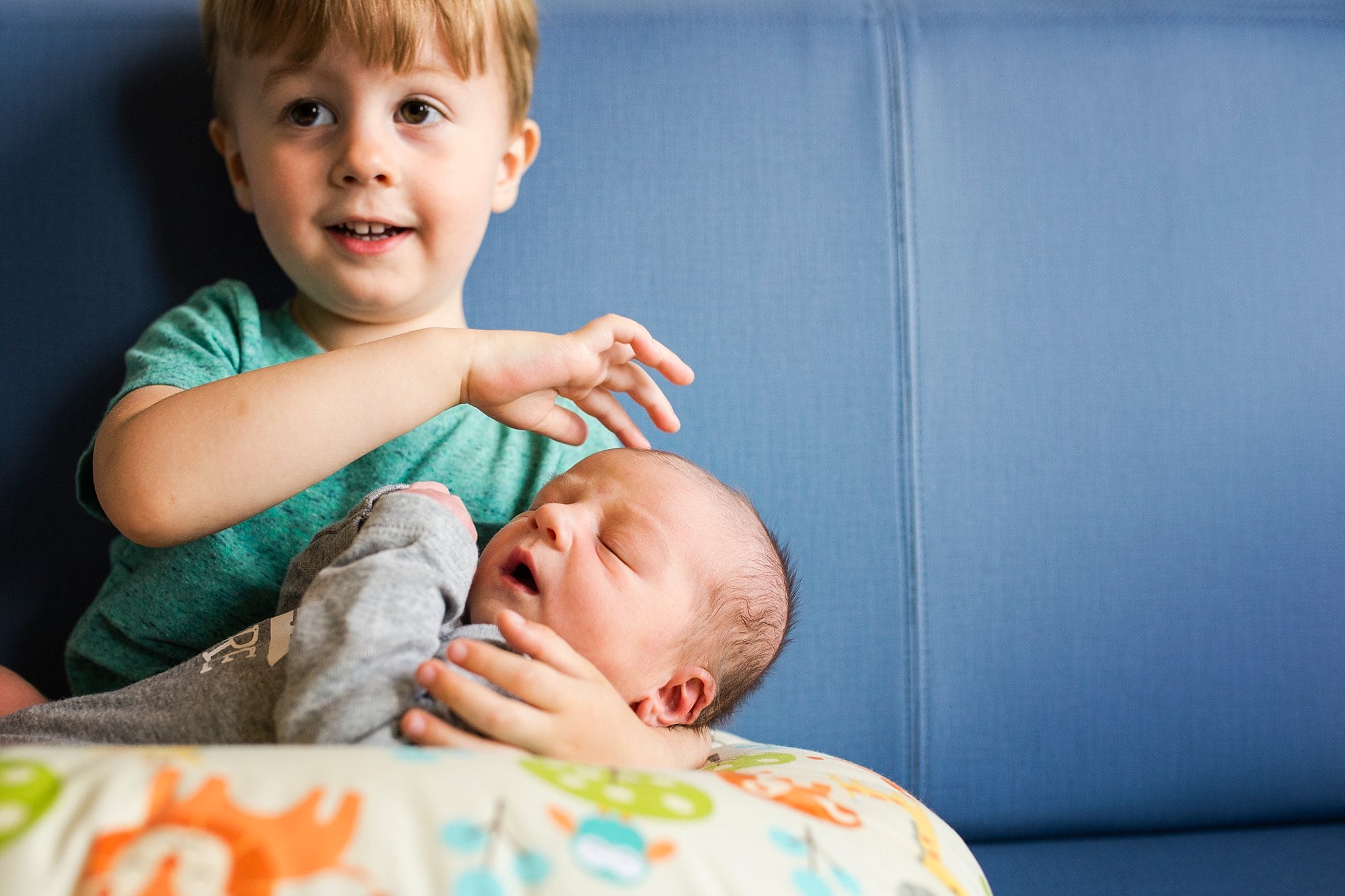 Toledo Hospital Baby Photos boy meeting new brother photo by Cynthia Dawson Photography