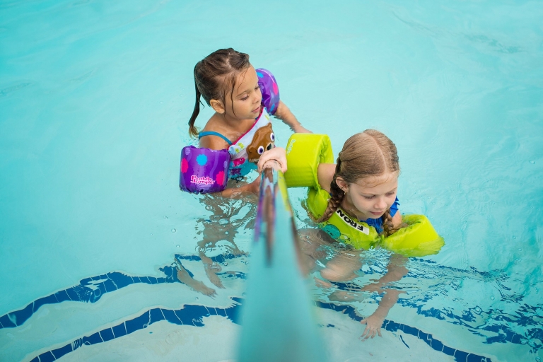 Toledo Ohio Lifestyle Photographer two girls in pool photo by Cynthia Dawson Photography