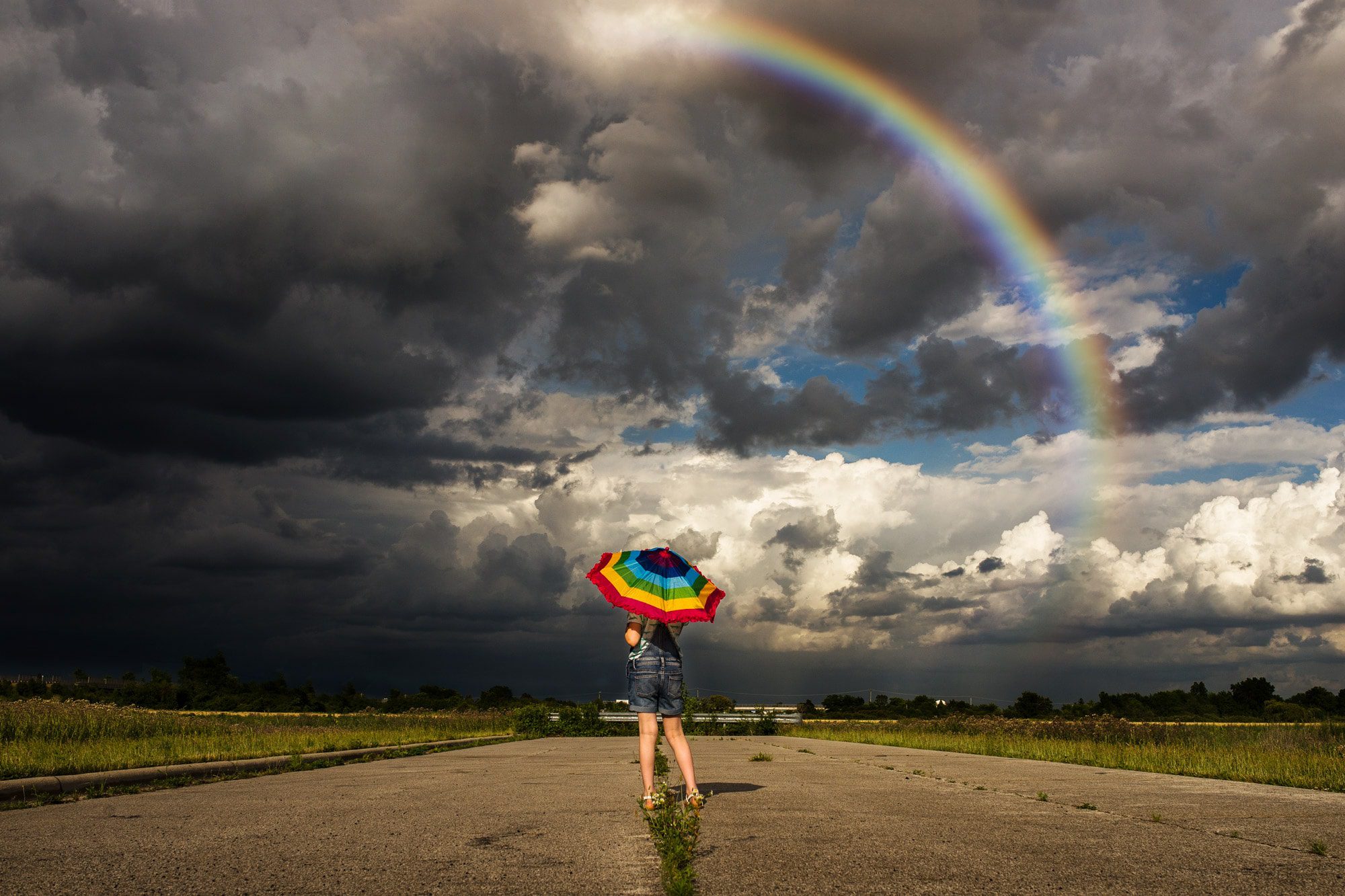 toledo child photographer girl with rainbow photo by Cynthia Dawson Photography