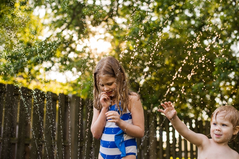 Toledo Ohio Summer Photo Session kids in sprinkler photo by Cynthia Dawson Photography
