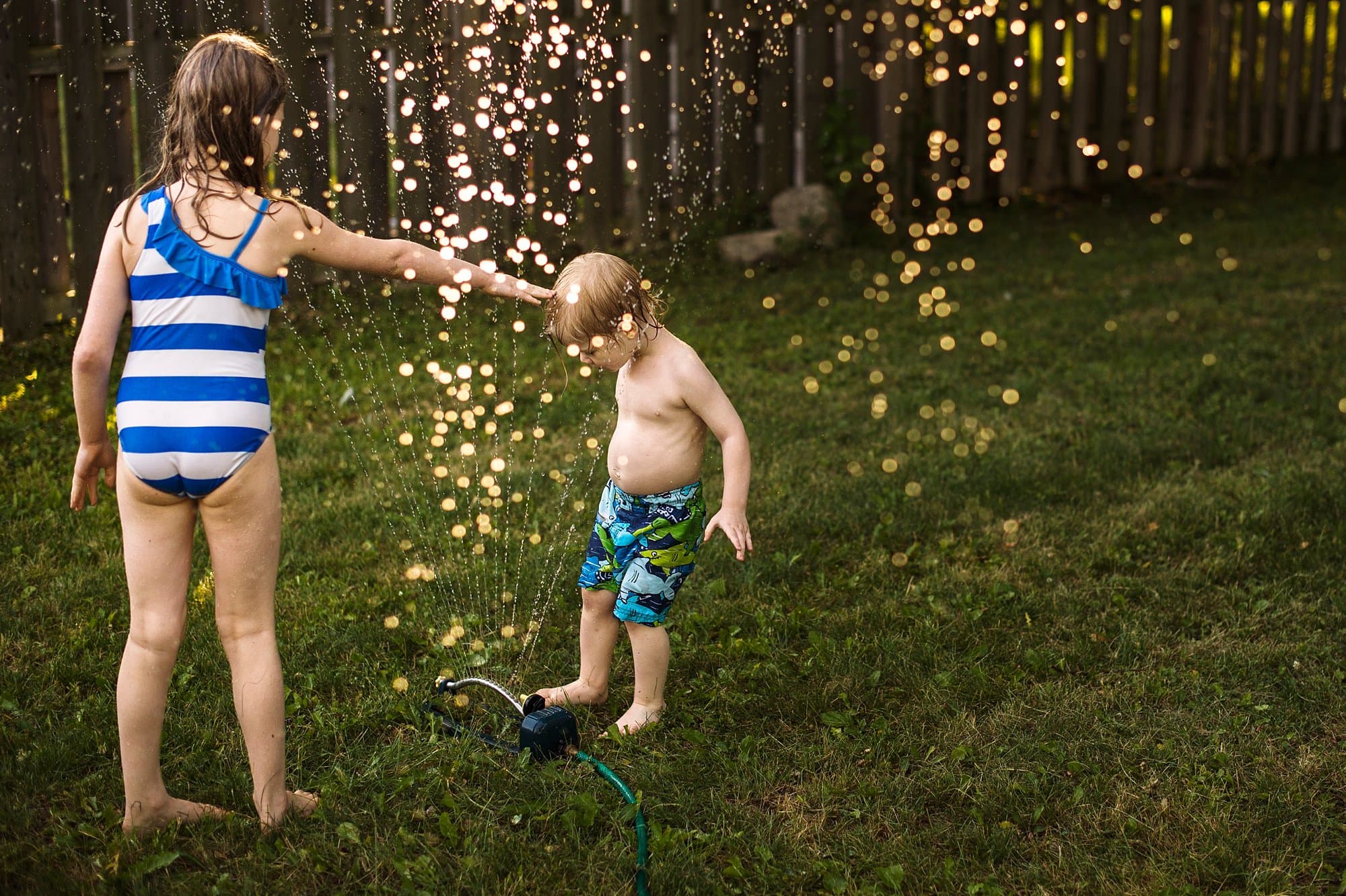 Summer Photo Session siblings playing in water photo by Cynthia Dawson Photography