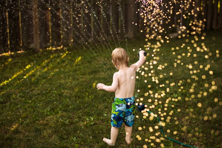 Toledo Summer Photo Session toddler playing in water photo by Cynthia Dawson Photography