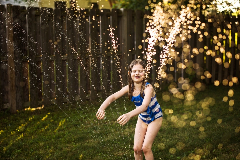 Toledo Ohio Summer Photo Session girl playing in water photo by Cynthia Dawson Photography