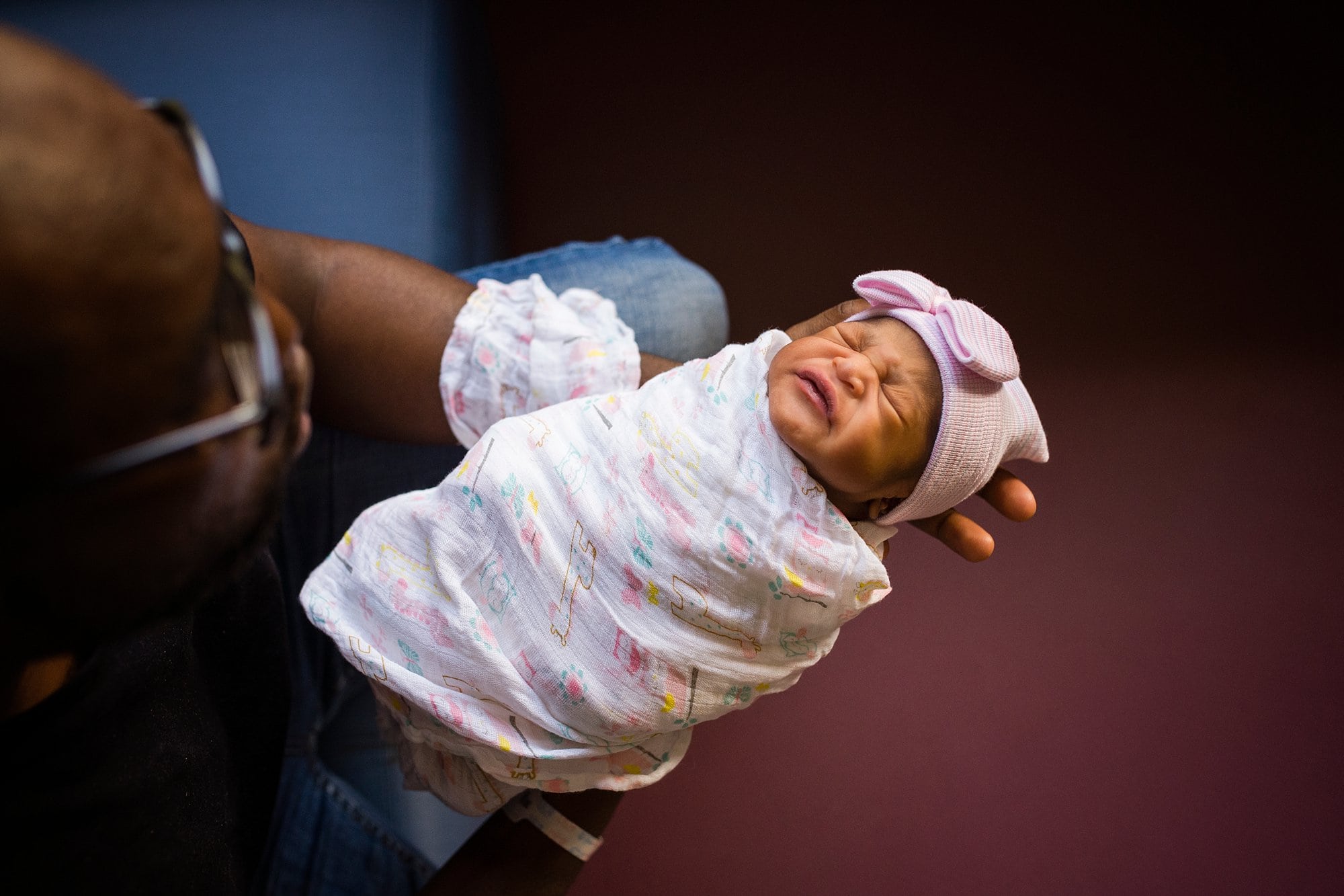 Toledo Ohio Newborn Hospital Photos dad with newborn girl in hospital photo by Cynthia Dawson Photography