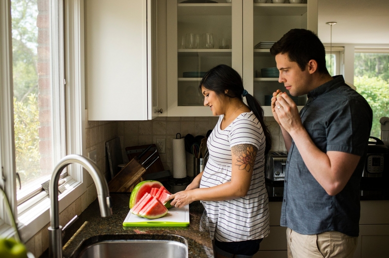 Toledo Lifestyle Maternity Photographer pregnant woman cutting watermelon photo by Cynthia Dawson Photography