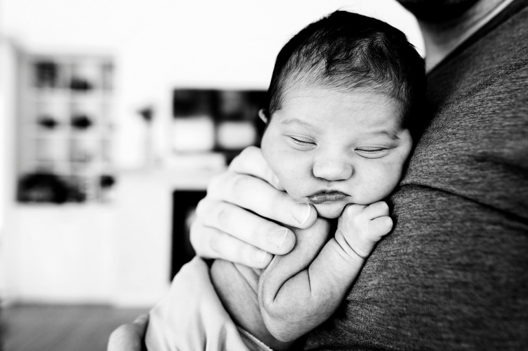 Toledo Ohio Newborn Lifestyle Photography dad holding newborn girl photo by Cynthia Dawson Photography