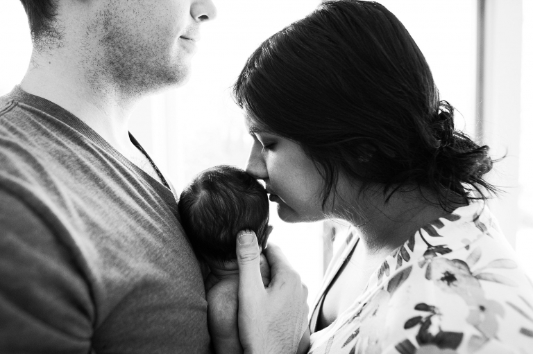 Newborn Lifestyle Photography Toledo Ohio mom kissing baby's head photo by Cynthia Dawson Photography