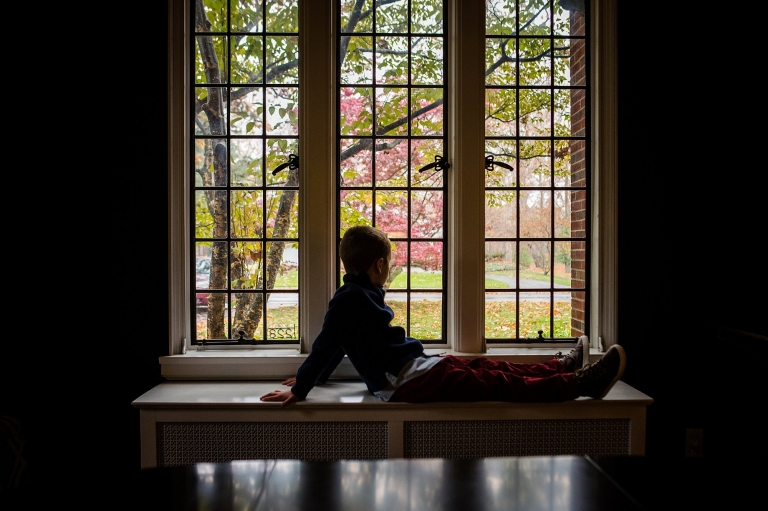 Toledo Ohio Family Photographer boy looking out window photo by Cynthia Dawson photography