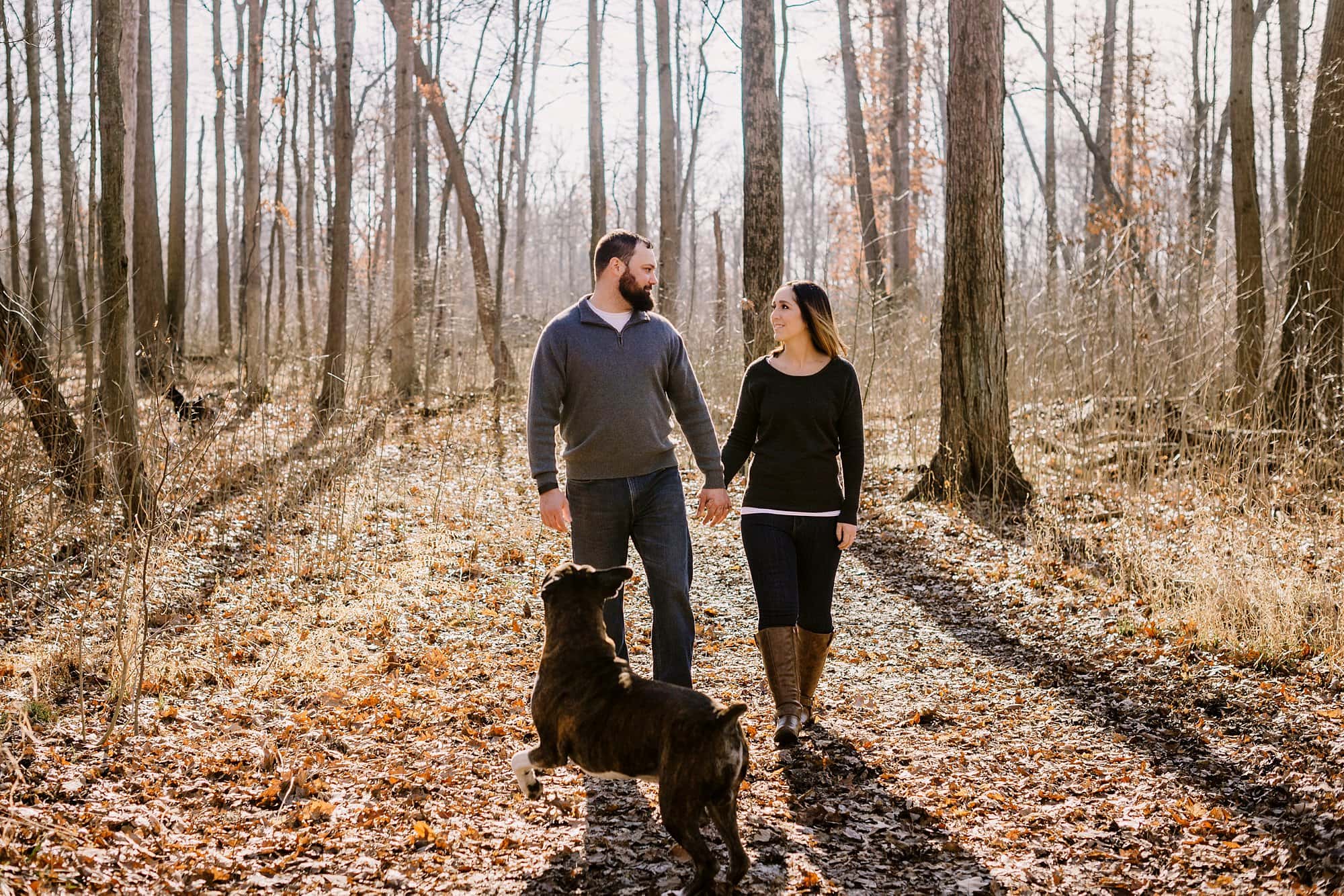 toledo ohio couple photographer couple walking with dog photo by cynthia dawson photography