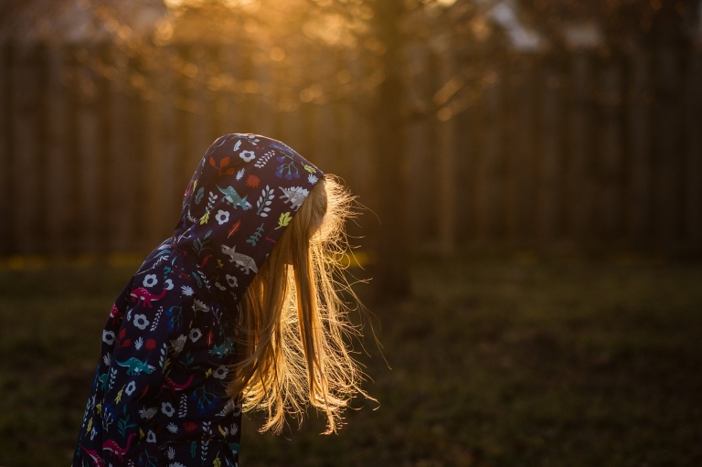 Toledo Child Photographer girl wearing hood outside photo by Cynthia Dawson Photography