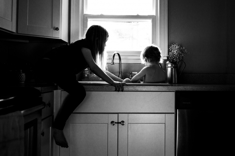 Lifestyle Photographer Toledo Ohio siblings in the kitchen sink photo by cynthia dawson photography