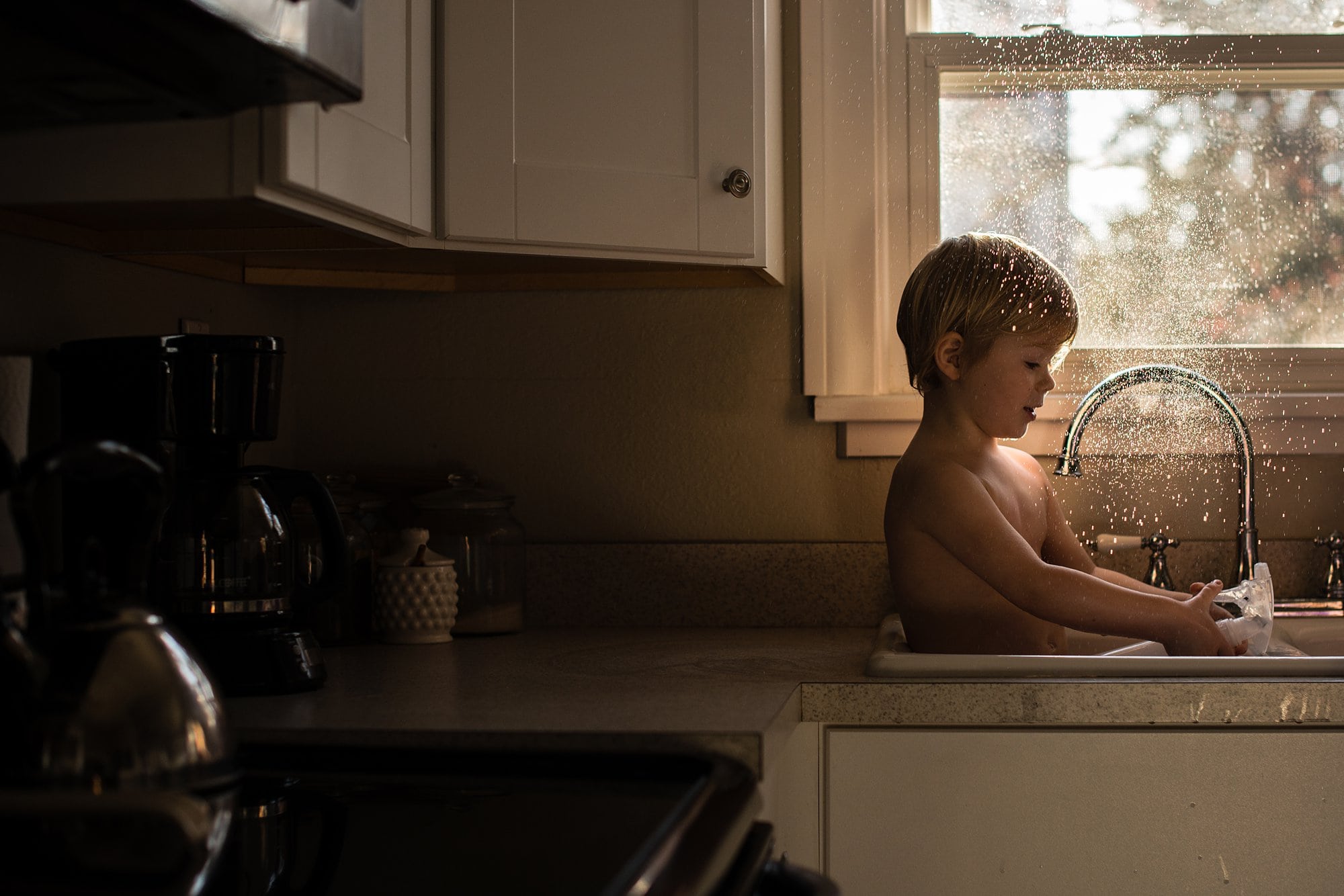 Lifestyle Photographer Toledo Ohio toddler splashing water photo by cynthia dawson photography