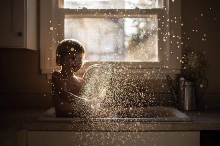 Lifestyle Photographer Toledo Ohio toddler splashing water photo by cynthia dawson photography