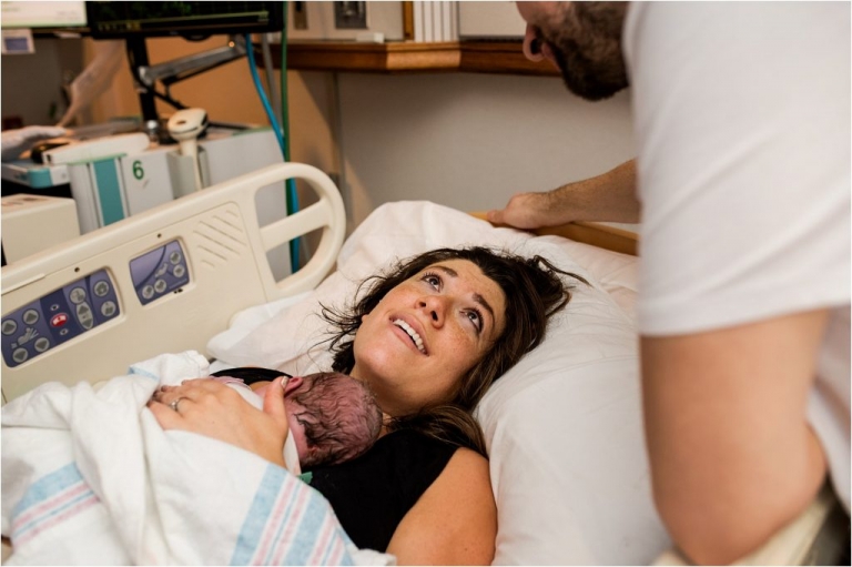 Toledo Ohio Birth Photographer mother holding newborn photo by Cynthia Dawson Photography