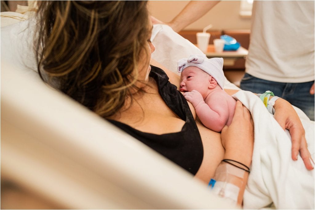 Toledo Ohio Birth Photographer mother holding newborn photo by Cynthia Dawson Photography